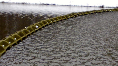 WaveEater barrier on an industrial pond